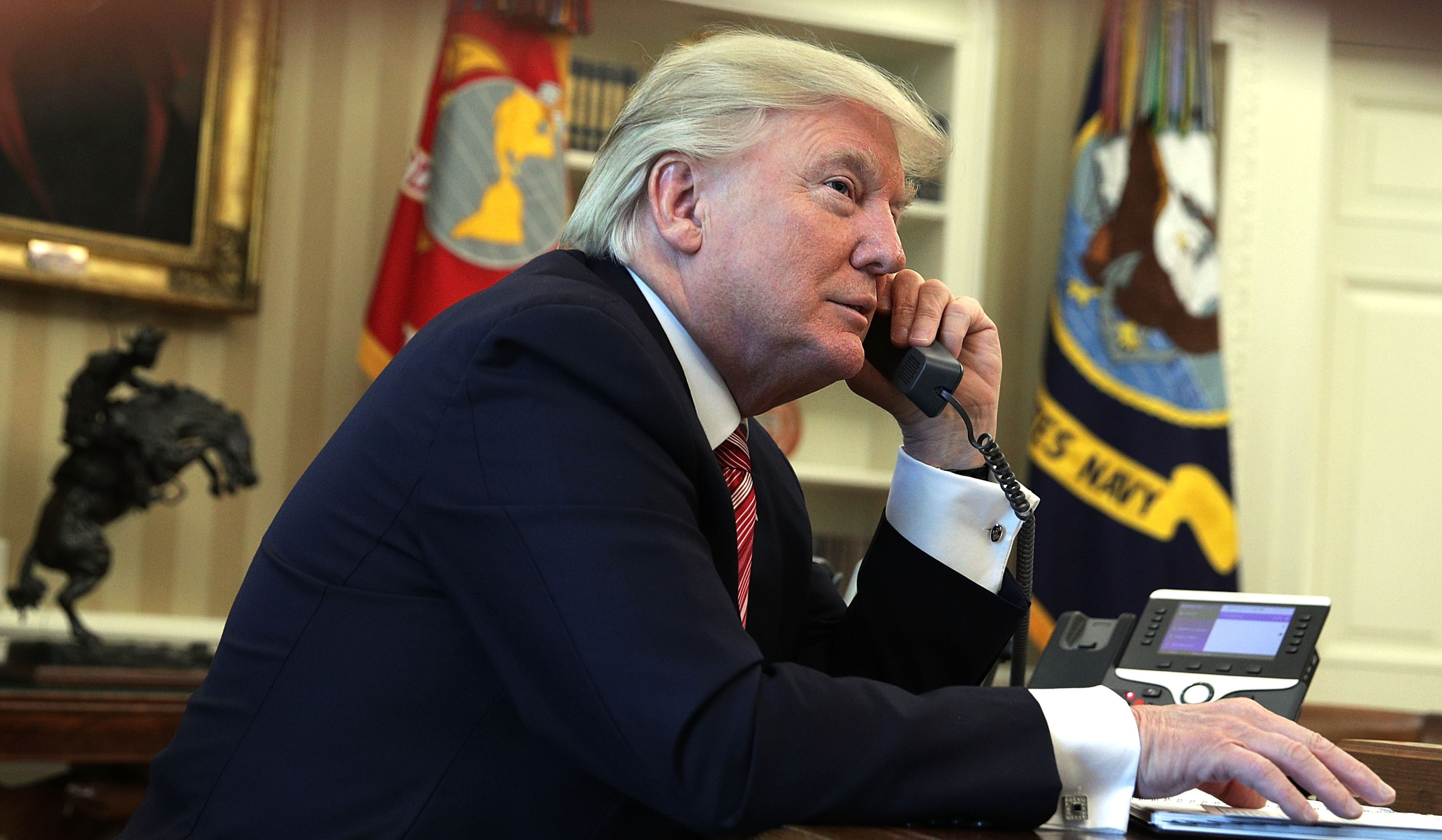 WASHINGTON, DC - JUNE 27: U.S. President Donald Trump speaks on the phone with Irish Prime Minister Leo Varadkar on the phone in the Oval Office of the White House June 27, 2017 in Washington, DC. President Trump congratulated Prime Minister Varadkar to become the new leader of Ireland. (Photo by Alex Wong/Getty Images)