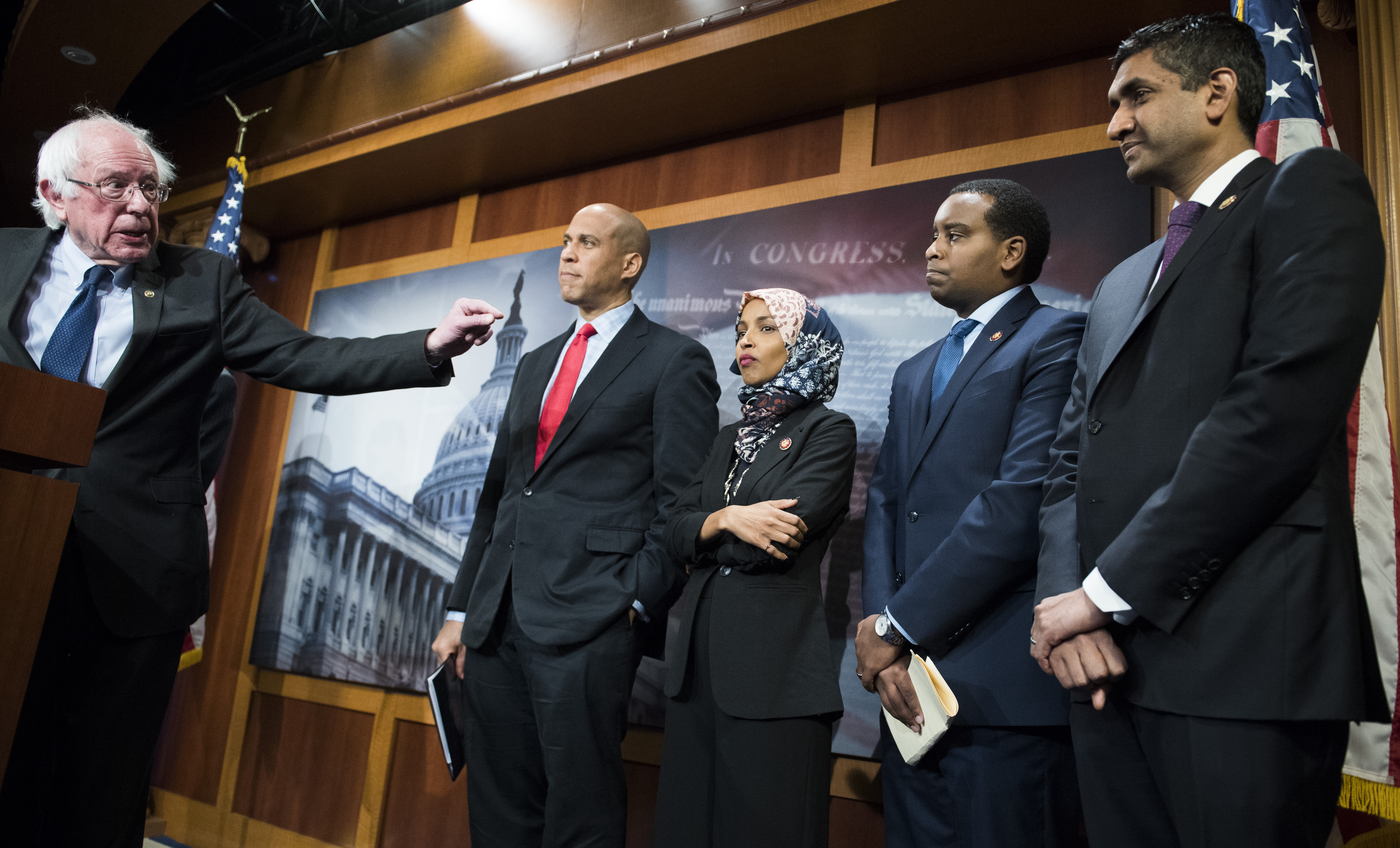 UNITED STATES - JANUARY 10: From left, Sens. Bernie Sanders, I-Vt., Cory Booker, D-N.J., Reps. Ilhan Omar, D-Minn., Joe Negues, D-Colo., and Ro Khanna, D-Calif., conduct a news conference in the Capitol to introduce a legislative package that would lower prescription drug prices in the U.S. on January 10, 2019. (Photo By Tom Williams/CQ Roll Call)