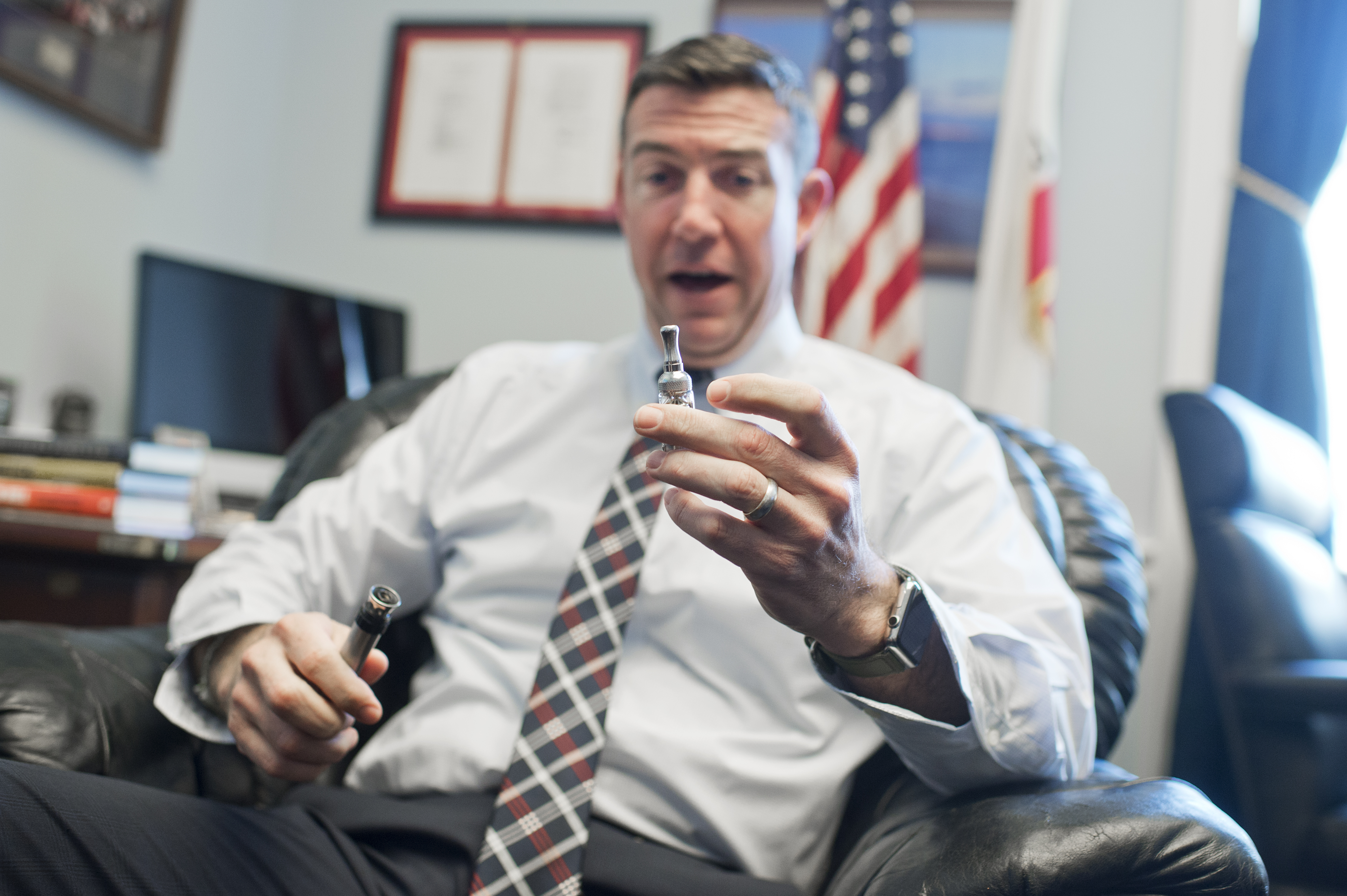 UNITED STATES - JANUARY 13: Rep. Duncan Hunter, R-Calif., is interviewed about his vaporizer pen in his Rayburn office, January 12, 2016. (Photo By Tom Williams/CQ Roll Call)