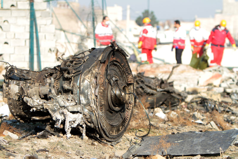 TEHRAN, IRAN - 2020/01/08: Rescue team at the crash site of a Ukrainian airliner that burst into flames shortly after take-off from Tehran on Wednesday, killing all 176 people aboard in a crash. (Photo by Mazyar Asadi/Pacific Press/LightRocket via Getty Images)