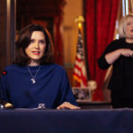 In a pool photo provided by the Michigan Office of the Governor, Gov. Gretchen Whitmer addresses the state during a speech in Lansing, Mich., Monday, March 30, 2020. The governor said she suspended state hiring and promotions and vetoed $80 million in new spending in order to steer money to fighting the coronavirus. At the same time, Whitmer said she signed laws with $150 million for the state's response. She said it's too early to know how the economic slowdown related to the virus will affect state revenue but the impact "is going to be real.” (Michigan Office of the Governor via AP, Pool)