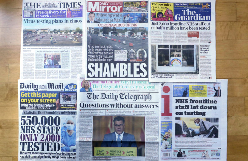 Front Pages of Britain's newspapers showing their coverage of the coronavirus, are displayed in London, Thursday, April 2, 2020. Newspapers in Britain have criticised the lack of testing NHS staff for the virus. The new coronavirus causes mild or moderate symptoms for most people, but for some, especially older adults and people with existing health problems, it can cause more severe illness or death. (AP Photo/Kirsty Wigglesworth)