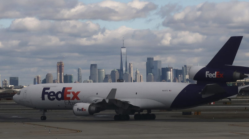 NEWARK, NJ - OCTOBER 13: A FedEx airplane makes its way to a runway in front of the skykine of New York City at Newark Liberty Airport on October 13, 2018 in Newark, New Jersey. (Photo by Gary Hershorn/Getty Images)