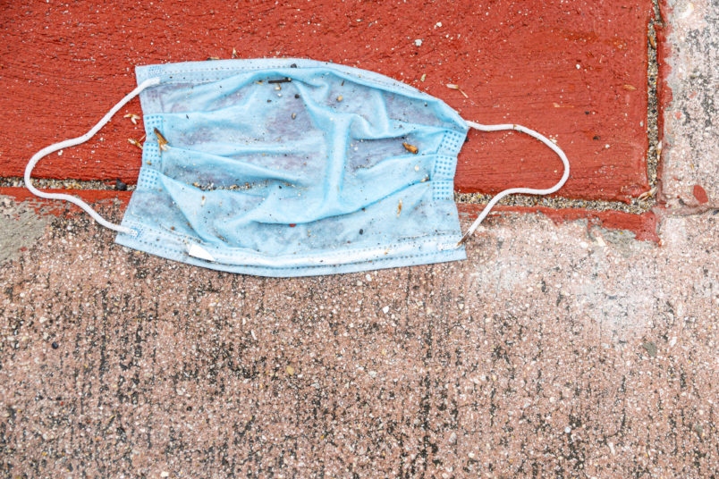 Florida, Miami Beach, North Beach, coronavirus Covid-19 pandemic crisis, discarded face mask, litter sidewalk,