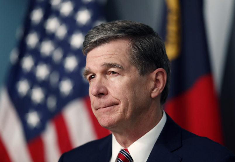 North Carolina Gov. Roy Cooper listens to a question during a briefing on the coronavirus pandemic at the Emergency Operations Center in Raleigh, N.C., Tuesday, May 26, 2020. (Ethan Hyman/Raleigh News & Observer/TNS)