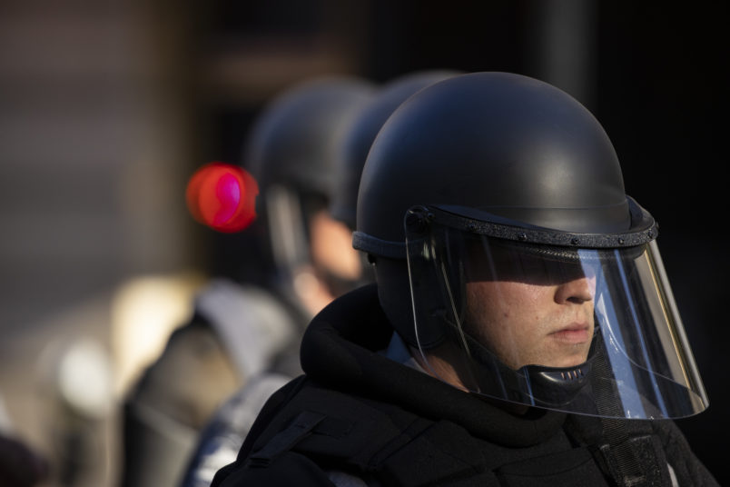 LOUISVILLE, KY - MAY 30:  Police officers in riot gear mobilize towards the park where protestors were gathered at on May 30, 2020 in Louisville, Kentucky. Protests have erupted after recent police-related incidents resulting in the deaths of African-Americans Breonna Taylor in Louisville and George Floyd in Minneapolis, Minnesota. (Photo by Brett Carlsen/Getty Images)