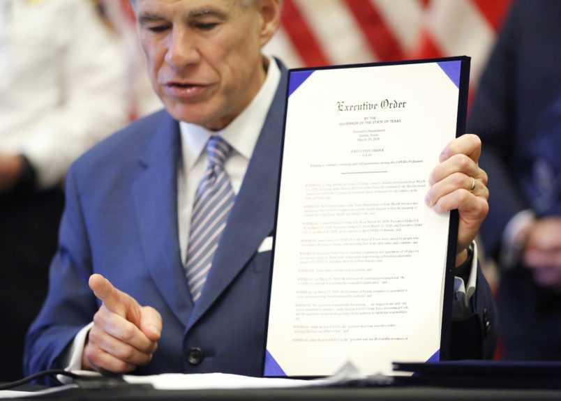 During a press conference at the Texas State Capitol in Austin, Texas Governor Greg Abbott holds a new executive order stating travel by road from any location in the state of Louisiana into Texas will require 14-day self quarantine, Sunday, March 29, 2020.  He also announced the US Army Corps of Engineers and the state are putting up a 250-bed field hospital at the Kay Bailey Hutchison Convention Center in downtown Dallas The space can expand to nearly 1,400 beds. (Tom Fox/The Dallas Morning News/Pool)