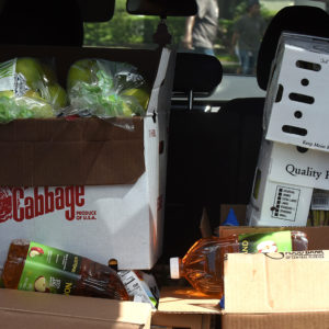 Boxes of food aid from the Second Harvest Food Bank of Central Florida are seen in the back of a car at a drive through food distribution event for the needy at Church in the Son on August 7, 2020 in Orlando, Florida. Food Banks in the Orlando area are bracing for a spike in demand as the $600 weekly enhanced unemployment benefits that the jobless have been receiving from the federal government expired at the end of July. (Photo by Paul Hennessy/NurPhoto)
