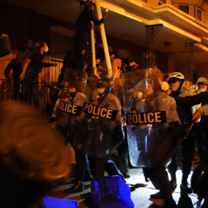 Police officers in formation during a protest in response to the police shooting of Walter Wallace Jr. on Monday, October 26, 2020 in Philadelphia, Pa. Police officers fatally shot the 27-year-old Black man during a confrontation Monday afternoon in West Philadelphia that quickly raised tensions in the neighborhood. Shortly before 4 p.m., two officers fired their guns at the man in the 6100 block of Locust Street. Police then transported the man to Penn Presbyterian Medical Center. He was later pronounced dead at the hospital. JESSICA GRIFFIN / The Philadelphia Inquirer