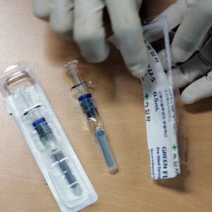 A man receives a H1N1 swine flu vaccine at XXXXX on October 27, 2009 in Seoul, South Korea. The Korea Food and Drug Administration approved domestically developped vaccines last week, the government plan to vaccinate 35 percent of South Korean population until next February.