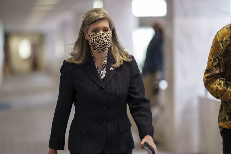 Sen. Joni Ernst, R-Iowa, arrives for a meeting with Senate Majority Leader Mitch McConnell, R-Ky., and fellow Republicans as they work toward the confirmation of Judge Amy Coney Barrett to the Supreme Court, at the Capitol in Washington, Monday, Oct. 26, 2020. The addition of Judge Barrett to the court would give conservatives six of the court’s nine seats. (AP Photo/J. Scott Applewhite)