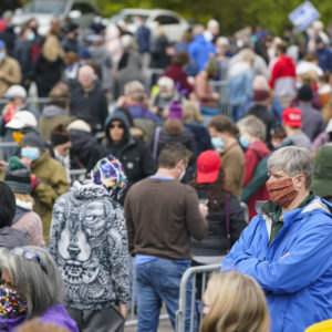 Voters wait in long lines to cast their ballots during early voting at St. Luke's United Methodist Church in Indianapolis, Wednesday, Oct. 28, 2020. The wait to vote was over 4 hours. (AP Photo/Michael Conroy)