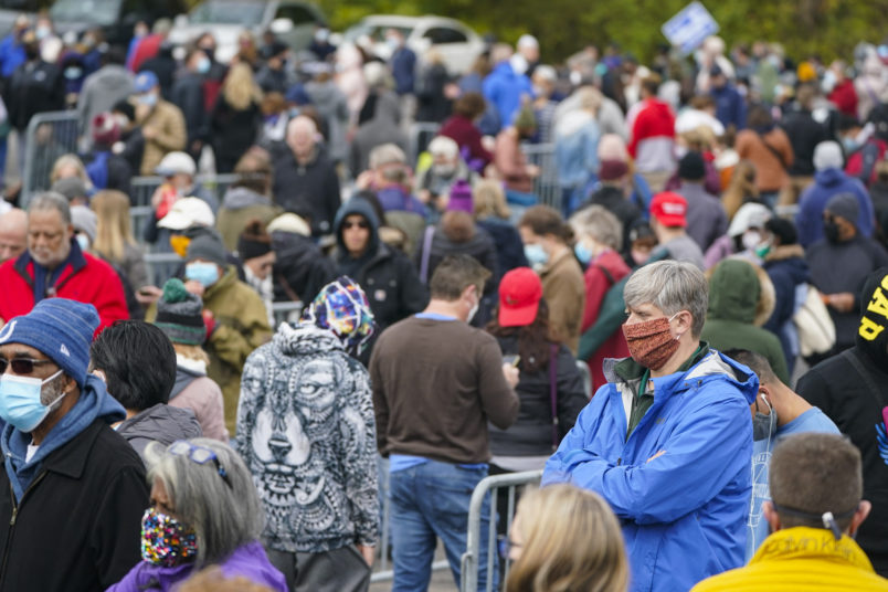 Voters wait in long lines to cast their ballots during early voting at St. Luke's United Methodist Church in Indianapolis, Wednesday, Oct. 28, 2020. The wait to vote was over 4 hours. (AP Photo/Michael Conroy)