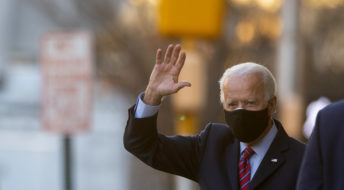 WILMINGTON, DE - NOVEMBER 23: President-elect Joe Biden waves as he departs the Queen Theatre after meeting virtually with the United States Conference of Mayors on November 23, 2020 in Wilmington, Delaware. As President-elect Biden waits to be approved for official national security briefings, the names of top members of his national security team are being announced to the public. (Photo by Mark Makela/Getty Images)