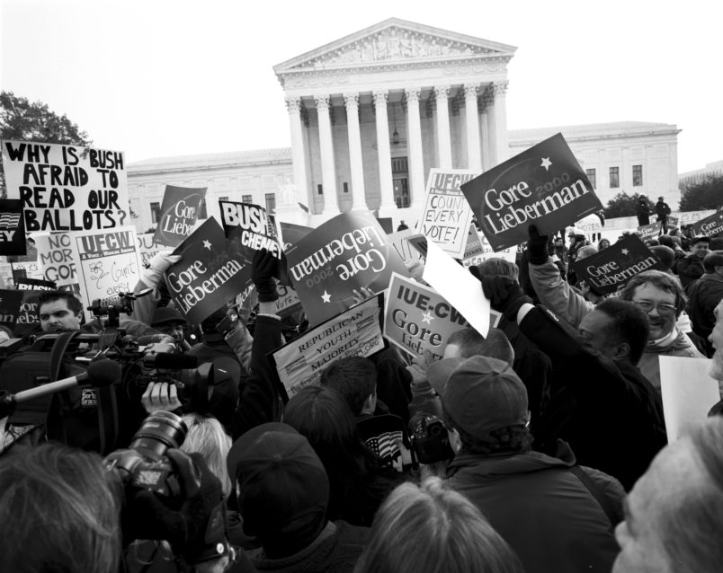 WASHINGTON DC - DECEMBER 11: Protesters outside the Supreme Court on the eve of the decision on Gore v Bush that will determine the outcome of the Presidential Election on December 11, 2000 in Washington DC. (Photo by David Hume Kennerly/Getty Images)