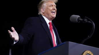 President Donald Trump speaks at a campaign rally for Senate Republican candidates, Sen. Kelly Loeffler, R-Ga., and Sen. David Perdue, R-Ga., at Valdosta Regional Airport, Saturday, Dec. 5, 2020, in Valdosta, Ga. (AP Photo/Evan Vucci)