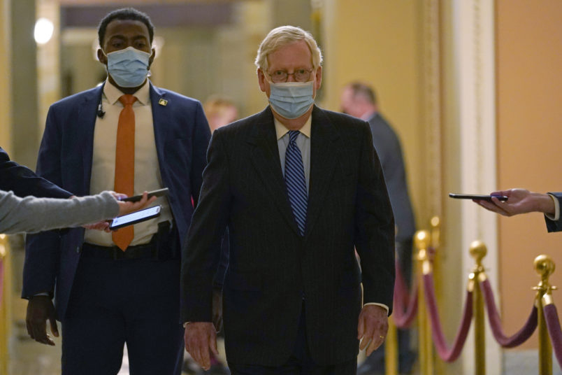 Senate Majority Leader Mitch McConnell of Ky., walks past reporters on Capitol Hill in Washington, Tuesday, Dec. 15, 2020. (AP Photo/Susan Walsh)