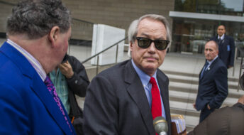 LOS ANGELES, CA - DECEMBER 03: British diver Vernon Unsworth; L, watches his attorneys; Mark Stephen; R, and L. Lin Wood; C, speaks to members of the media while they arrive at US District Court, Central District of California in Los Angeles, U.S. on December 3, 2019 in Los Angeles, California. The British diver sued the Tesla CEO Elon Musk over calling him "'Pedo Guy" and rapist. (Photo by Apu Gomes/Getty Images)