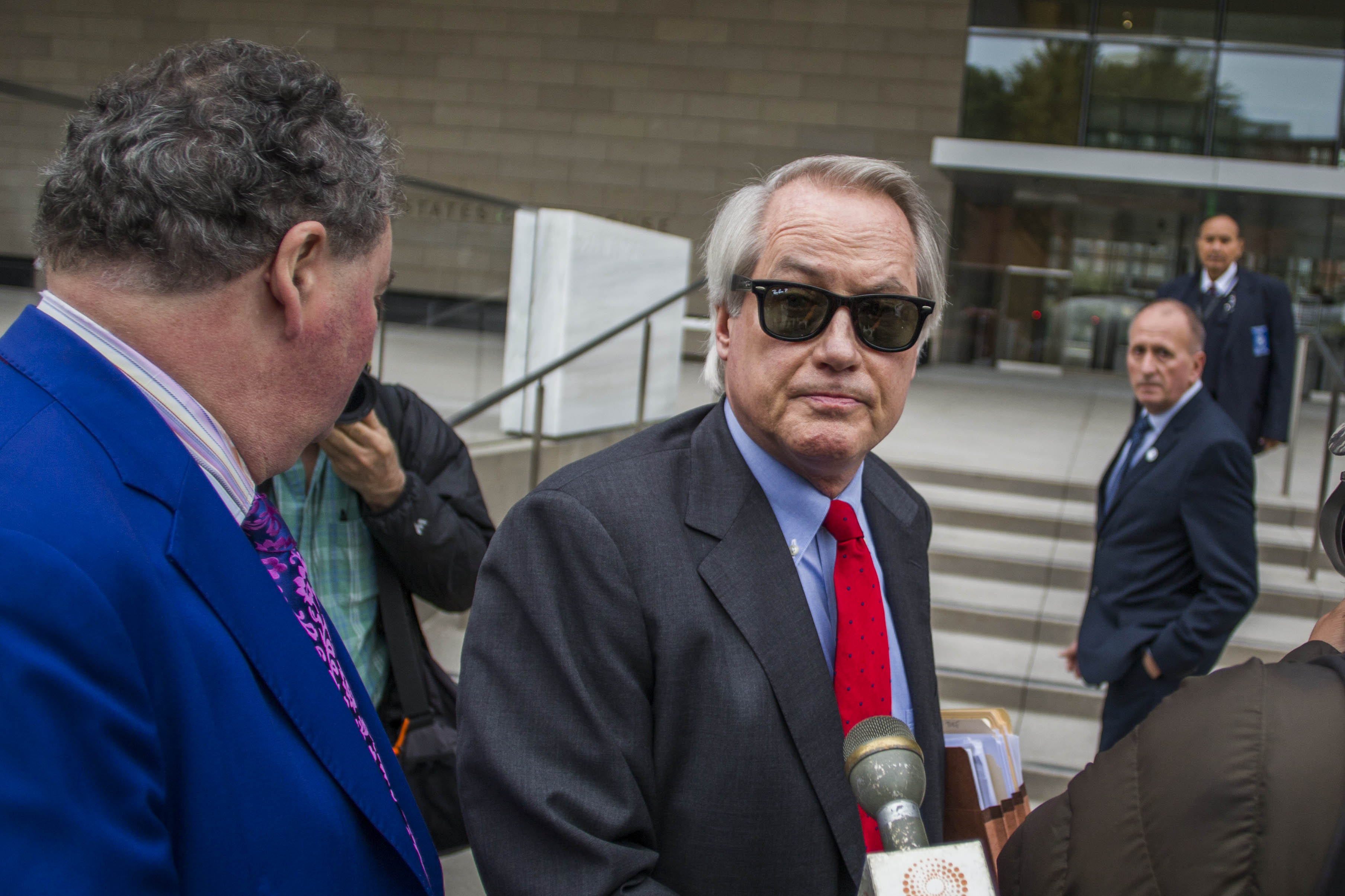 LOS ANGELES, CA - DECEMBER 03: British diver Vernon Unsworth; L, watches his attorneys; Mark Stephen; R, and L. Lin Wood; C, speaks to members of the media while they arrive at US District Court, Central District of California in Los Angeles, U.S. on December 3, 2019 in Los Angeles, California. The British diver sued the Tesla CEO Elon Musk over calling him "'Pedo Guy" and rapist. (Photo by Apu Gomes/Getty Images)