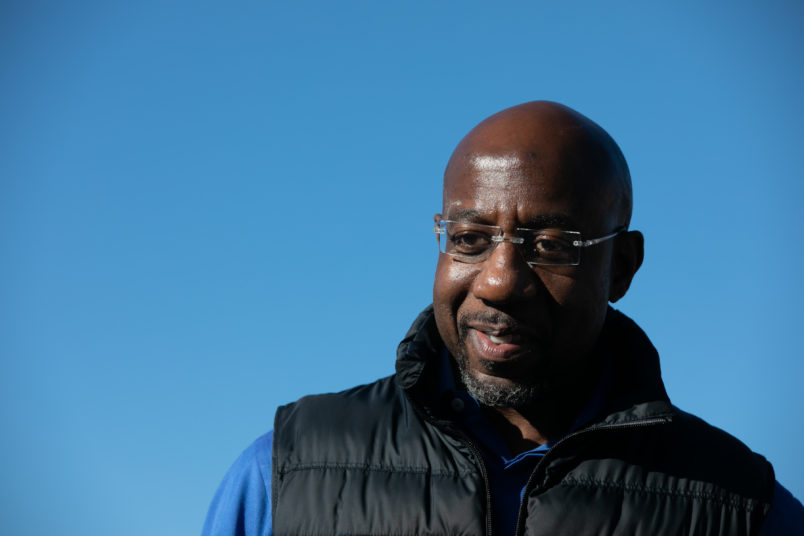 CONYERS, GA - DECEMBER 05: Democratic U.S. Senate candidate Raphael Warnock during an outdoor drive-in rally on December 5, 2020 in Conyers, Georgia. Warnock faces Republican candidate Sen. Kelly Loeffler (R-GA) in a runoff election that will take place January 5th. (Photo by Jessica McGowan/Getty Images)