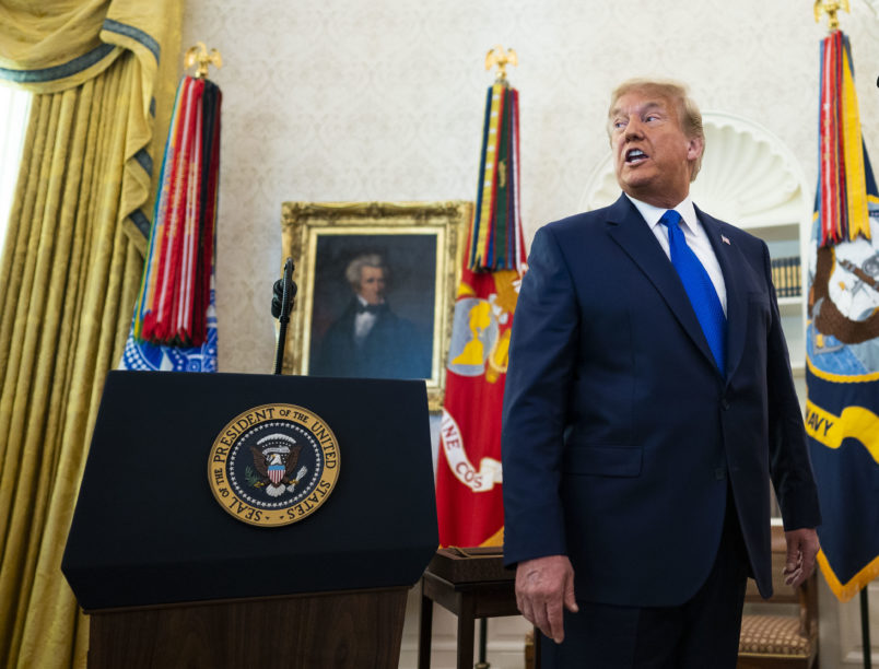 President Donald Trump presents the Presidential Medal of Freedom to Dan Gable in the Oval Office, Monday, Dec, 7, 2020.   ( Photo by Doug Mills/The New York Times)