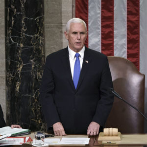 Vice President Mike Pence readS the final certification of Electoral College votes cast in November's presidential election during a joint session of Congress after working through the night, at the Capitol in Washington, Thursday, Jan. 7, 2021. Violent protesters loyal to President Donald Trump stormed the Capitol Wednesday, disrupting the process. (AP Photo/J. Scott Applewhite, Pool)