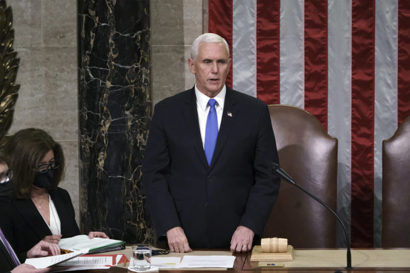 Vice President Mike Pence readS the final certification of Electoral College votes cast in November's presidential election during a joint session of Congress after working through the night, at the Capitol in Washington, Thursday, Jan. 7, 2021. Violent protesters loyal to President Donald Trump stormed the Capitol Wednesday, disrupting the process. (AP Photo/J. Scott Applewhite, Pool)