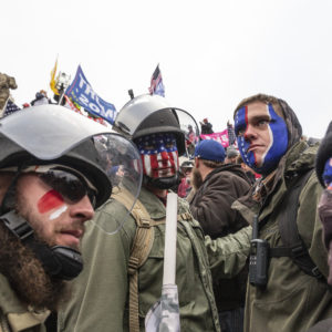 WASHINGTON DC, DISTRICT OF COLUMBIA, UNITED STATES - 2021/01/06: Pro-Trump protesters trying to enter Capitol building. Rioters broke windows and breached the Capitol building in an attempt to overthrow the results of the 2020 election. Police used batons and tear gas grenades to eventually disperse the crowd. Rioters used metal bars and tear gas as well against the police. (Photo by Lev Radin/Pacific Press/LightRocket via Getty Images)
