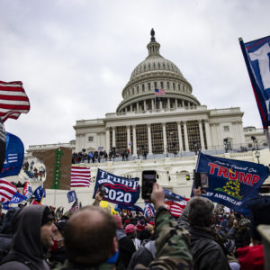 WASHINGTON, DC - JANUARY 06: Pro-Trump supporters storm the US Capitol following a rally with President Donald Trump on January 6, 2021 in Washington, DC. Trump supporters gathered in the nation's capital today to protest the ratification of President-elect Joe Biden's Electoral College victory over President Trump in the 2020 election. (Photo by Samuel Corum/Getty Images)