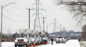FORT WORTH, TX - FEBRUARY 16: Pike Electric service trucks line up after a snow storm on February 16, 2021 in Fort Worth, Texas. Winter storm Uri has brought historic cold weather to Texas and storms have swept across 26 states with a mix of freezing temperatures and precipitation. (Photo by Ron Jenkins/Getty Images)