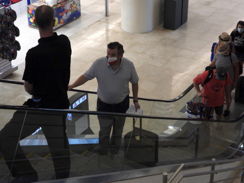 CANCUN, QUINTANA ROO - FEBRUARY 18: Ted Cruz checks in for a flight at Cancun International Airport after a backlash over his Mexican family vacation as his home state of Texas endured a Winter storm. The Republican politician came under fire after jetting to the warm holiday destination as hundreds of thousands of people in the lone star state suffered a loss of power. Reports stated that Cruz was due to catch a flight back to Houston, Texas on February 18, 2021 in Cancun, Quintana Roo. (Photo by MEGA/GC Images)