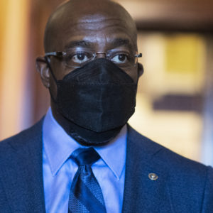 UNITED STATES - MARCH 23: Sen. Raphael Warnock, D-Ga., is seen during a Senate vote in the Capitol on Tuesday, March 23, 2021. (Photo By Tom Williams/CQ Roll Call)