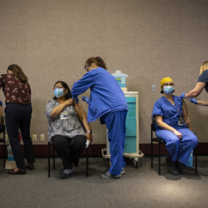 PORTLAND, OR - DECEMBER 16 : Healthcare workers get the Pfizer-BioNTech COVID-19 vaccination at the Legacy Emanuel Medical Center on December 16, 2020 in Portland, Oregon. Today was the first day of vaccinations in Oregon. (Photo by Paula Bronstein/Getty Images)