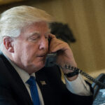 WASHINGTON, DC - JANUARY 28: President Donald Trump speaks on the phone with Russian President Vladimir Putin in the Oval Office of the White House, January 28, 2017 in Washington, DC. On Saturday, President Trump is making several phone calls with world leaders from Japan, Germany, Russia, France and Australia. (Photo by Drew Angerer/Getty Images)