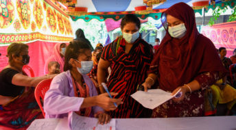DHAKA, BANGLADESH - 2021/08/18: A health worker seen registering sex workers against the Covid-19 coronavirus at special vaccination drive held in Daulatdia outskirt of Dhaka. (Photo by Piyas Biswas/SOPA Images/LightRocket via Getty Images)