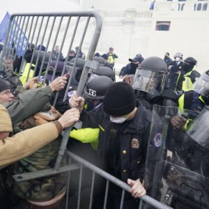 WASHINGTON, DC - JANUARY 06:  Police try to hold back protesters who  gather storm the Capitol and halt a joint session of the 117th Congress on Wednesday, Jan. 6, 2021 in Washington, DC. (Kent Nishimura / Los Angeles Times)